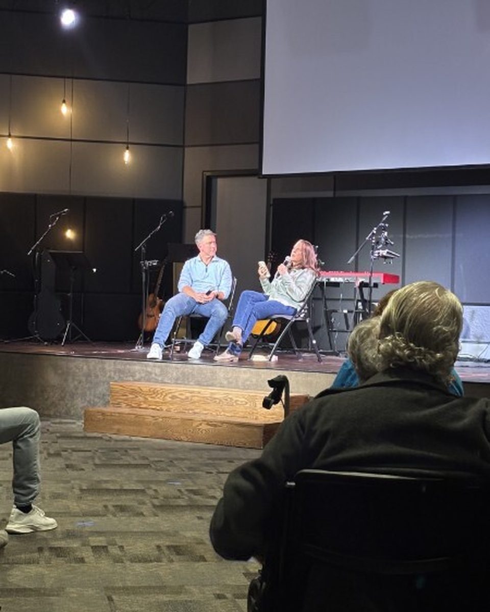 Friends praying together during the gathering